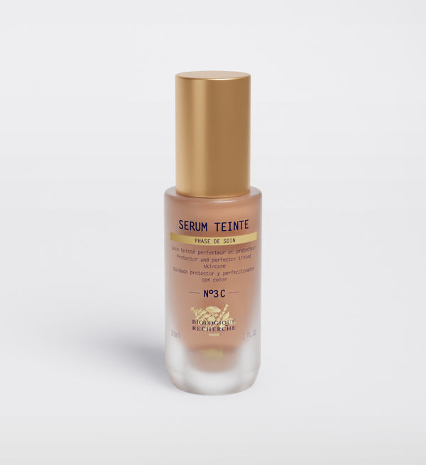 The Biologique Recherche Serum Teinte N3 Cold features a gold cap, product info text on the front, and offers photo-protecting properties for radiant skin.