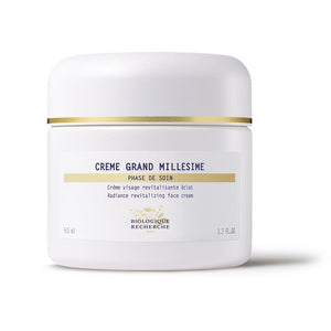 White jar of "Biologique Recherche Crème Grand Millesime" face cream, labeled as a revitalizing radiance beauty cream for devitalized skin.