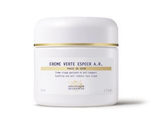 A 50 ml white jar of Biologique Recherche Crème Verte Espoir A.R. face cream, with gold accents and anti-redness label, offers soothing relief for rosacea-prone skin.