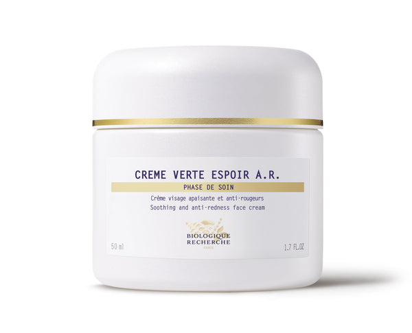 A 50 ml white jar of Biologique Recherche Crème Verte Espoir A.R. face cream, with gold accents and anti-redness label, offers soothing relief for rosacea-prone skin.