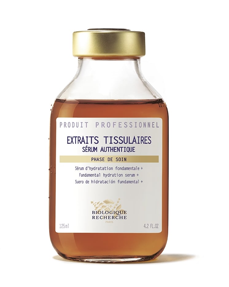 A 125ml, 4.2 fl oz glass bottle with a gold cap contains Biologique Recherche Serum Extraits Tissulaires, an instant moisturizer that boosts skin's protective barrier for lasting hydration.