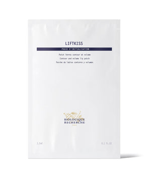 The Biologique Recherche Liftkiss lip patch, in minimalist white packaging, features text on its powerful formula to repair lips and reduce dehydration wrinkles, promoting plumper lips.