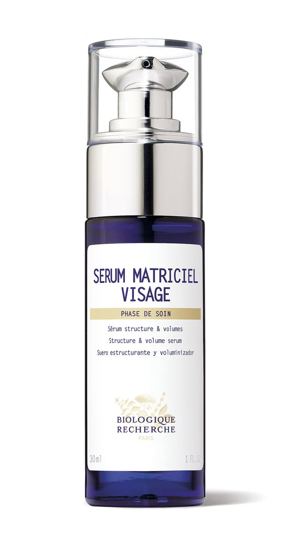 A 30ml clear bottle of Biologique Recherche Serum Matriciel Visage features a pump dispenser and contains a serum that enhances skin tissue and addresses facial hollows.