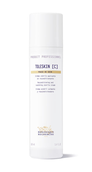 A white bottle of Biologique Recherche Creme Toleskin, designed for professional reconditioning and soothing skin sensitivity, labeled in multiple languages.