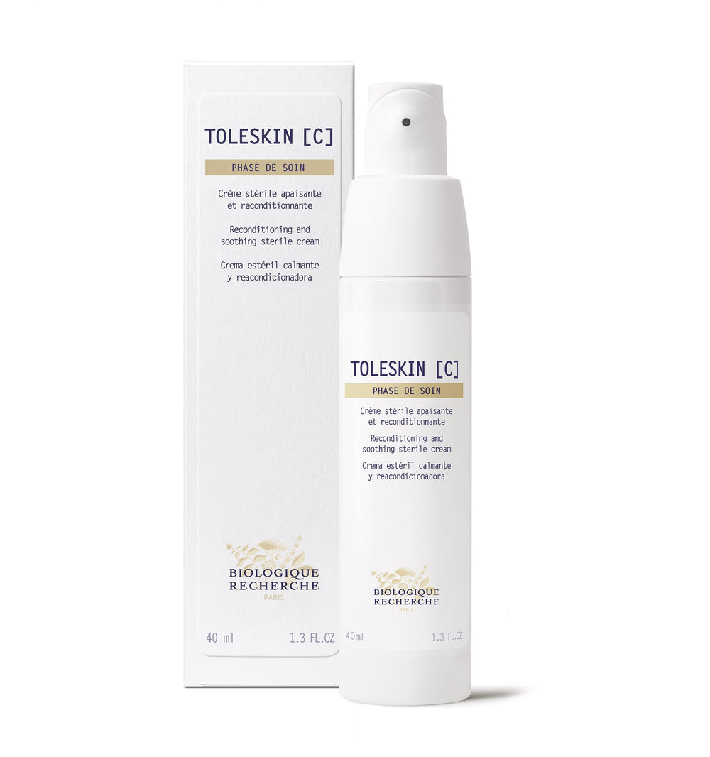 White bottle of Biologique Recherche Creme Toleskin, a sterile reconditioning and soothing cream for sensitive, red skin, beside its matching box.