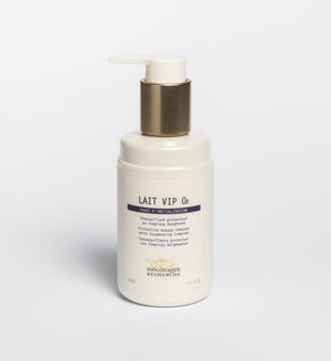 A white bottle of Biologique Recherche Lait VIP O2 anti-pollution cleanser with a pump, set against a plain background—ideal for refreshing urban skin.