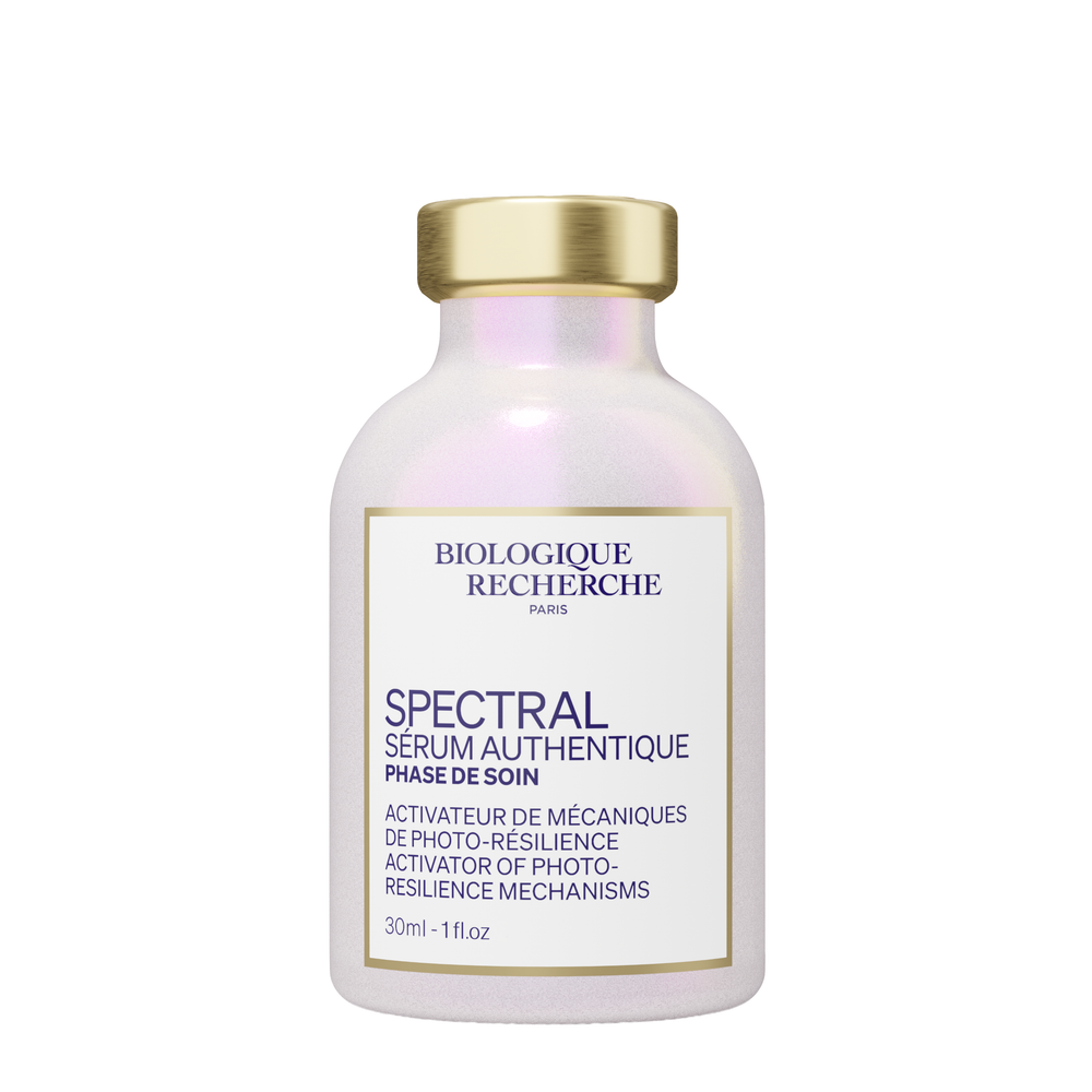 A 30ml bottle of Biologique Recherche Spectral Serum features a gold cap and a white label with product details in both French and English.
