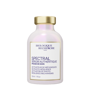 A 30ml bottle of Biologique Recherche Spectral Serum features a gold cap and a white label with product details in both French and English.