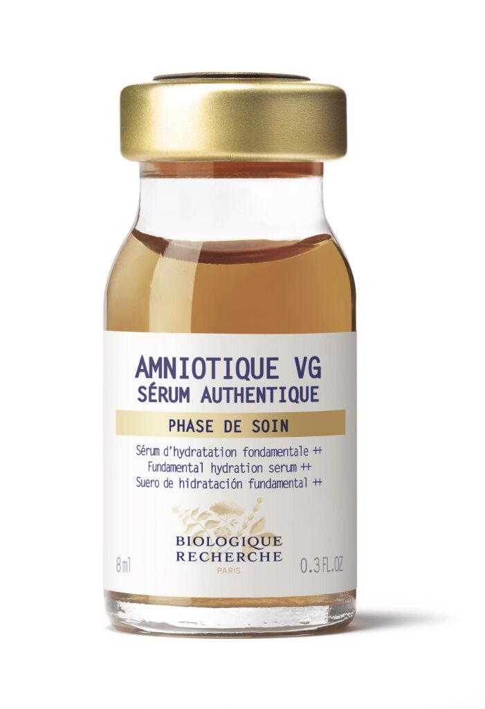 A 30 ml glass bottle of Biologique Recherche Serum Amniotique VG with a gold cap, featuring a luxurious hydrating formula designed to combat dryness.