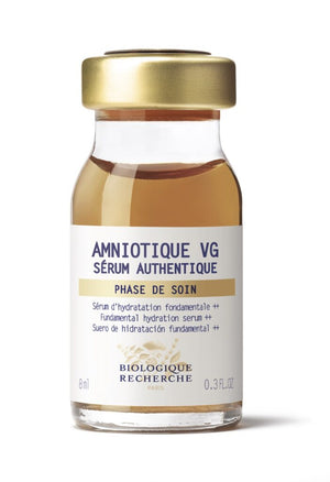 An 8ml glass bottle of Biologique Recherche Serum Amniotique VG, a hydrating serum for dryness, featuring a gold cap and white label with product details.