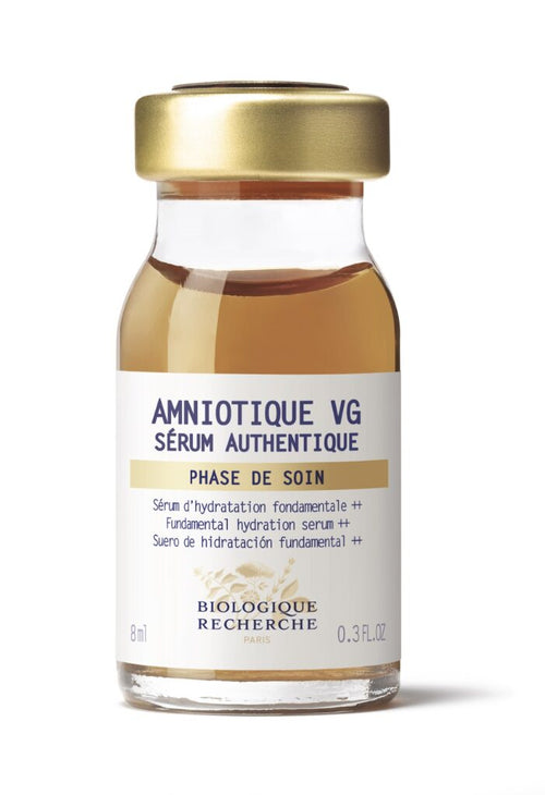 An 8ml glass bottle of Biologique Recherche Serum Amniotique VG, a hydrating serum for dryness, featuring a gold cap and white label with product details.