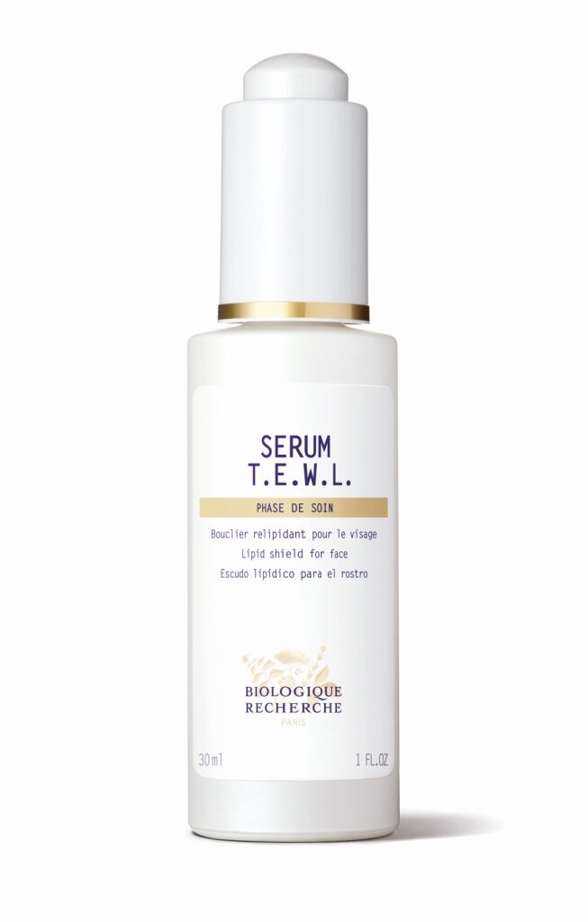 A 30ml white bottle of Biologique Recherche Serum T.E.W.L., featuring a gold band, acts as a lipidic shield serum designed for dehydrated or lipid-deficient skin.