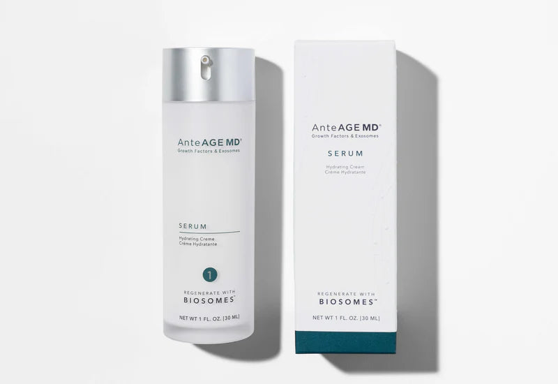 A bottle and box of AnteAGE MD Biosome Serum, 1 fl. oz. (30 mL), are shown on a white surface with light shadows, emphasizing its combination of growth factors and antioxidants.