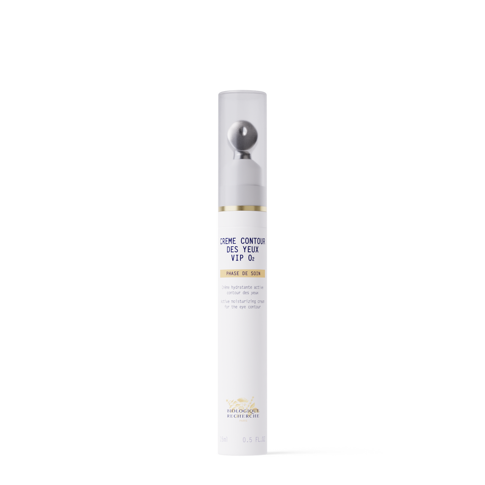 A white cylindrical bottle of New Formula - Creme Contour des Yeux VIP O2 eye cream with a metallic roller applicator and clear cap, designed to target dark circles, stands upright on a plain white background.