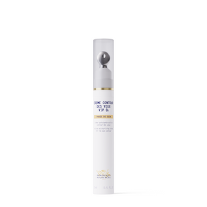 A white cylindrical bottle of New Formula - Creme Contour des Yeux VIP O2 eye cream with a metallic roller applicator and clear cap, designed to target dark circles, stands upright on a plain white background.