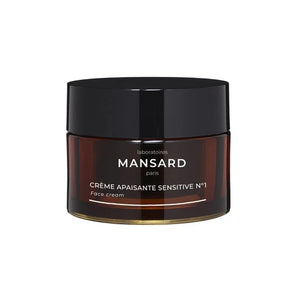 A brown jar with a black lid labeled “Mansard - Crème Apaisante Sensitive No. 1” is displayed against a white background, showcasing this soothing face cream formulated as a moisturizer and redness relief solution for sensitive skin.