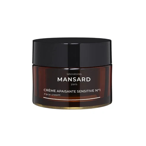 A brown jar with a black lid labeled “Mansard - Crème Apaisante Sensitive No. 1” is displayed against a white background, showcasing this soothing face cream formulated as a moisturizer and redness relief solution for sensitive skin.