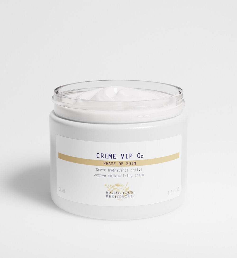 A white jar labeled "New Formula - Crème VIP 02" holds an oxygenating face cream with a smooth, creamy texture that provides active moisturizing and regenerating benefits.