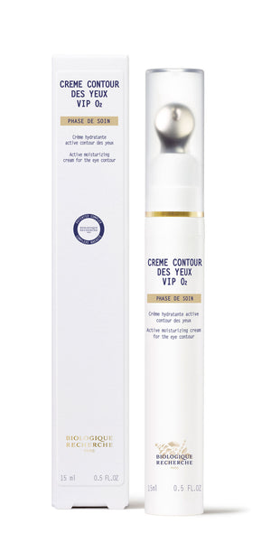 A white and gold 15ml bottle of New Formula - Creme Contour des Yeux VIP O2 brightening eye cream is shown beside its box—designed to target dark circles.