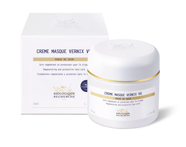 Biologique Recherche Crème Masque Vernix VG in a white jar with gold accents, beside its detailed box featuring a blue certification stamp. Enriched with antioxidant peptides, this luxurious masque revitalizes and protects for a radiant glow.