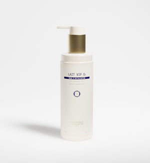 A white pump bottle labeled "Lait VIP 02" with a gold dispenser, featuring the New Formula - Lait VIP 02 Cleansing Milk, is displayed against a plain white background.