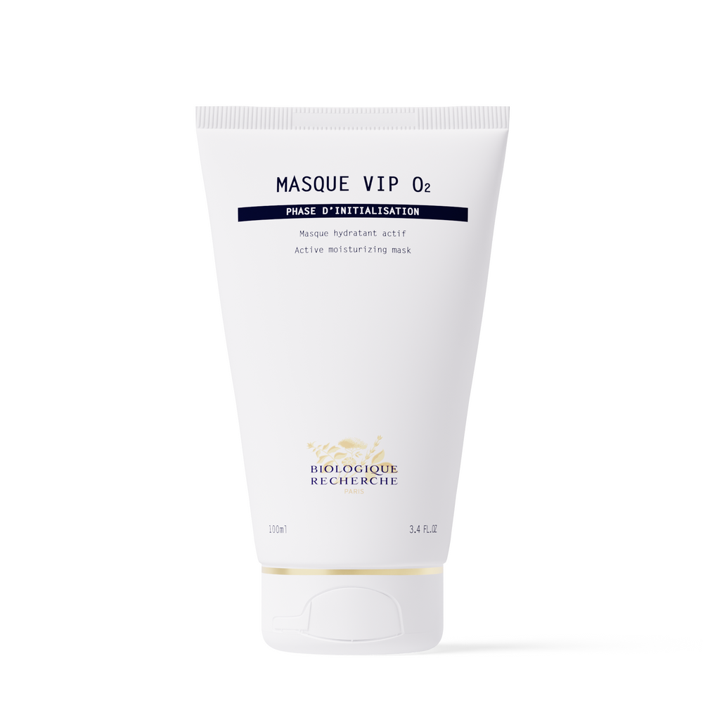 A white tube and box of New Formula - Masque VIP 02, 100 ml, designed to brighten complexion and reveal glowing skin, stand upright against a plain background.