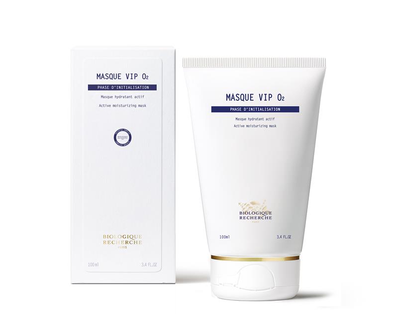 A white tube and box of New Formula - Masque VIP 02, 100 ml, designed to brighten complexion and reveal glowing skin, stand upright against a plain background.