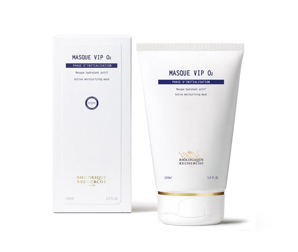 A white tube and box of New Formula - Masque VIP 02, 100 ml, designed to brighten complexion and reveal glowing skin, stand upright against a plain background.