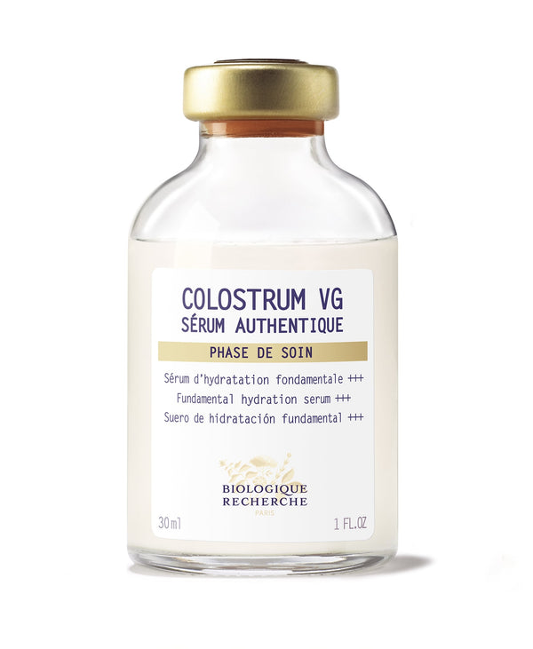 A bottle of Colostrum VG 1oz Serum, famous for nourishing and hydrating the skin, labeled in three languages against a clean white background.