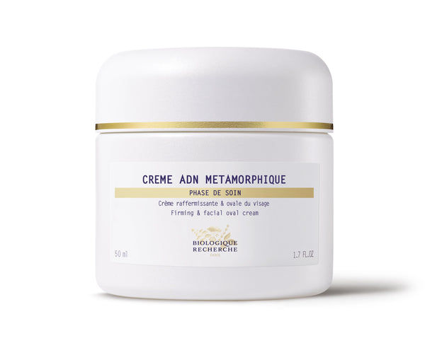 Biologique Recherche Crème ADN Metamorphique, 50 ml, is an anti-aging firming facial cream in a white jar with a gold stripe near the lid for lifting effects.