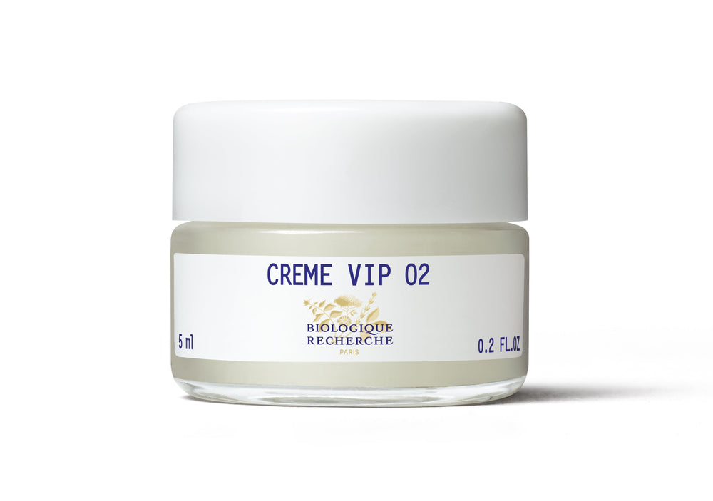 The Biologique Recherche Crème VIP O2 is a white jar with a gold-striped lid, serving as an oxygenating cream that brightens the complexion and provides antipollution protection.