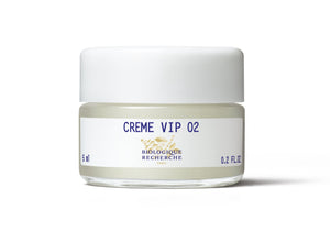 Biologique Recherche Crème VIP O2, 5 ml, features a white label and cap. This small jar of oxygenating cream brightens your complexion and serves as an antipollution shield for the skin.