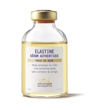 A 1 oz bottle of Biologique Recherche Serum Elastine features a gold cap with tri-lingual labels, highlighting its line-correcting Biomarine formula that boosts skin elasticity and reduces wrinkles.