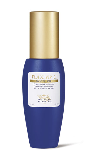 The Biologique Recherche Fluide VIP O2, in a blue and gold bottle against a white backdrop, is a 1 oz anti-pollution serum with an oxygenating formula that revitalizes, refreshes, and protects your skin.