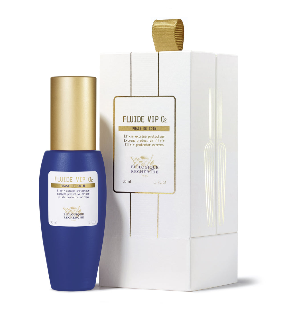 The Biologique Recherche Fluide VIP O2, in a blue and gold bottle against a white backdrop, is a 1 oz anti-pollution serum with an oxygenating formula that revitalizes, refreshes, and protects your skin.