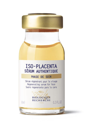 The 0.3oz ISO Placenta Serum by Biologique Recherche has a gold cap and multilingual labeling, highlighting its use as a regenerating serum for the face.