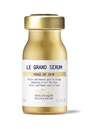 The Biologique Recherche Le Grand Serum, in a gold 0.3 oz bottle, features multilingual text and is marketed as an enhancing facial elixir to fight premature aging. It’s enriched with antioxidants for deep moisturization.