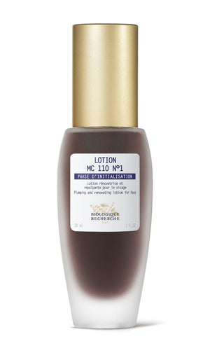 1 oz brown bottle of Biologique Recherche MC 110 No. 1 with gold cap, labeled as a plumping and renovating facial lotion that tones and exfoliates.