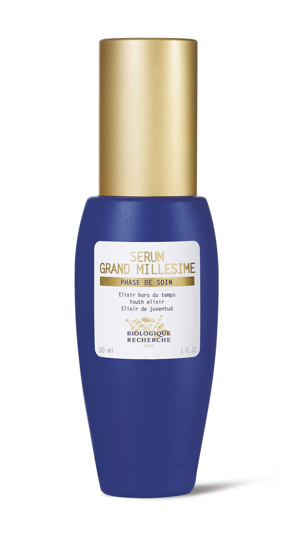 A blue bottle of Biologique Recherche Serum Grand Millesime - 1 oz, infused with antioxidant agents and capped in gold, is labeled as a treatment.