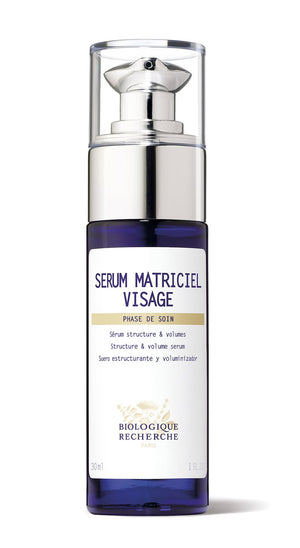A 30ml clear bottle of Biologique Recherche Serum Matriciel Visage features a pump dispenser and contains a serum that enhances skin tissue and addresses facial hollows.