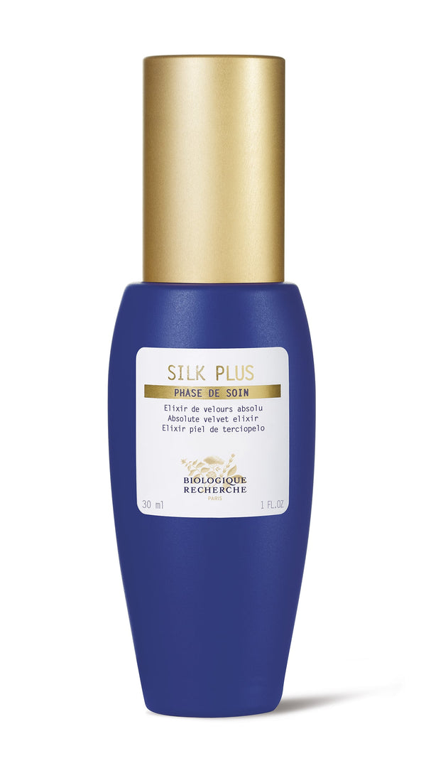 This Biologique Recherche Silk Plus moisturizing serum comes in a blue bottle with a gold cap and features Hyaluronic Acid for a smooth skin experience.