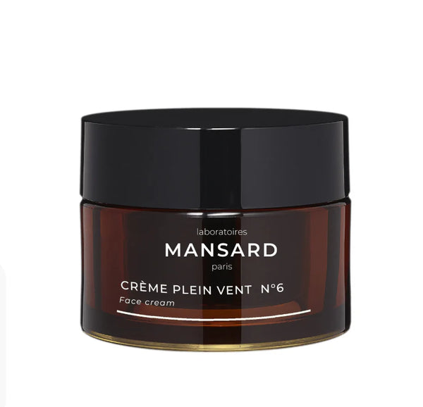 A brown jar with a black lid labeled "Mansard Creme Plein Vent No 6 Face Cream.