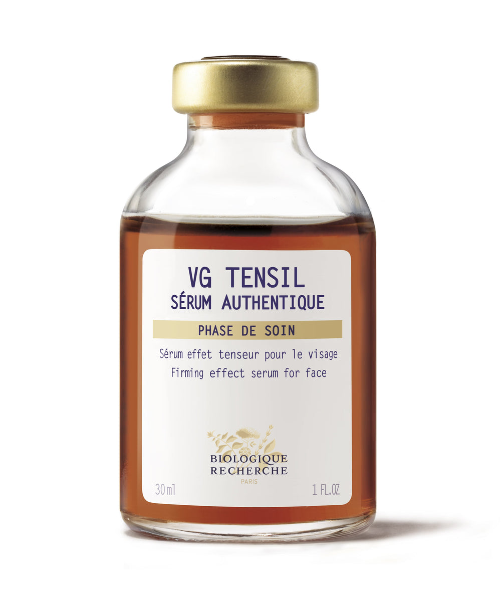 A 1 oz bottle of Serum VG Tensil by Biologique Recherche provides a facial treatment to tighten and firm the skin, featuring a gold cap and white label for authentic rejuvenation.