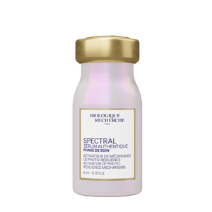 A small 8 ml (0.3 fl. oz) bottle of Biologique Recherche Spectral Serum with a gold cap and a white label showing the product name and size.