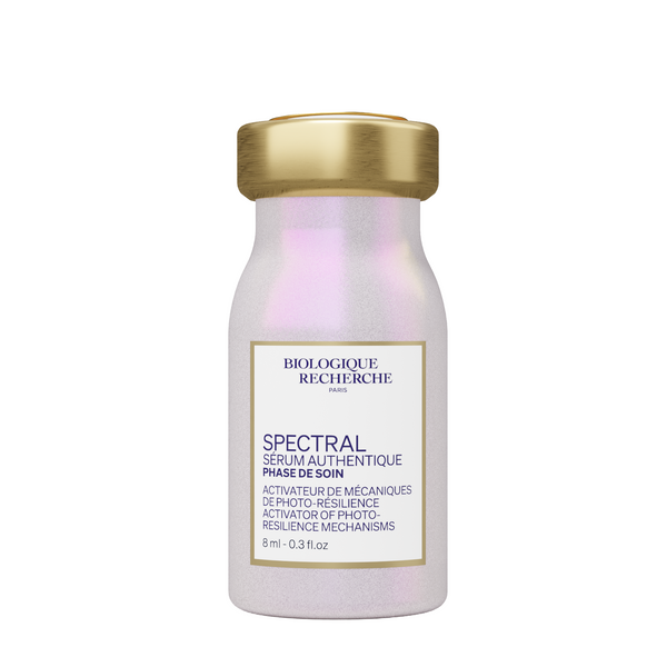 A small 8 ml (0.3 fl. oz) bottle of Biologique Recherche Spectral Serum with a gold cap and a white label showing the product name and size.