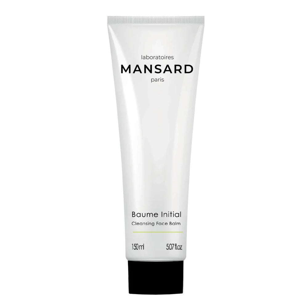 A white tube labeled "Mansard Baume Initial - Cleansing face balm," 150 ml, with a black cap—a gentle makeup remover and cleansing balm formulated with nourishing squalane.