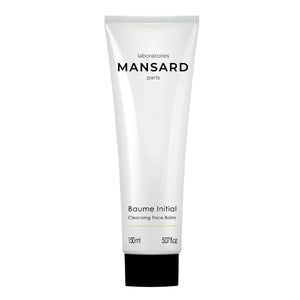 A white tube labeled "Mansard Baume Initial - Cleansing face balm," 150 ml, with a black cap—a gentle makeup remover and cleansing balm formulated with nourishing squalane.